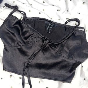 Satin black crop top.
